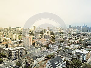 Aerial view historic Victorian houses and modern skyline background