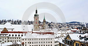 Aerial view of historical buildings covered in snow in winter. Cathedral in St Gallen, Switzerland