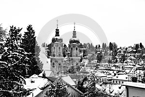 Aerial view of historical buildings covered in snow in winter. Cathedral in St Gallen, Switzerland. Black and white