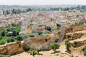 Aerial view of historical Moroccan Arabic town Fez with its city wall and soukhs