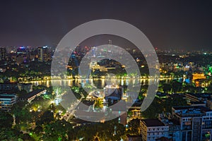 Aerial view of a Hoan Kiem lake or Sword lake, Ho Guom in Vietnamese at night. Hanoi skyline view. Hoan Kiem lake is center of Han