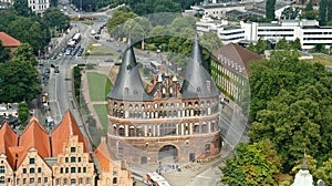 Aerial view of Holsten Gate or Holstentor in old town, beautiful architecture, sunny day, Lubeck, Germany