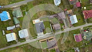 Aerial view of home roofs in residential rural neighborhood area.