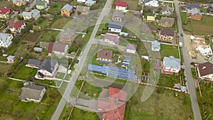 Aerial view of home roofs in residential rural neighborhood area.