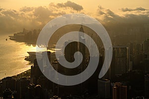 Aerial view of Hong Kong Central district and Victoria Harbour during sunrise, China