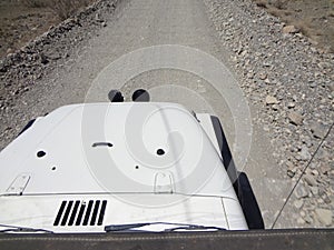 Aerial View of Hood of White Jeep TJ Driving on Dirt Road