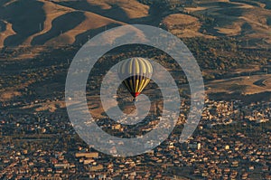 aerial view of hot air balloon over fairy chimneys,