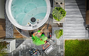 Aerial View of Hot Tub Technician Performing Garden SPA Repair