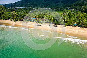 Aerial view of hotels and resorts next to the tropical Nangthong Beach in Khao Lak, Thailand