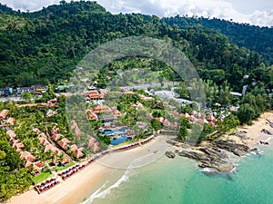 Aerial view of hotels and resorts next to the tropical Nangthong Beach in Khao Lak, Thailand