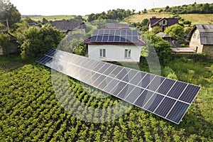 Aerial view of a house with blue solar panels for clean energy photo