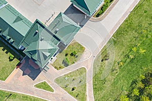 Aerial view of house with green metal shingle roof