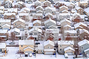 Aerial view of houses against a landscape of snowy terrain on a cold winter day