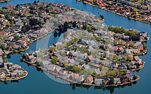 Aerial view of houses in Foster City section on Central Lake canals by the San Francisco Bay in San Mateo County, California photo