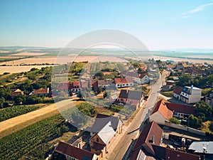 Aerial view of houses roofs and fields