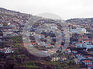 Aerial view of the of houses and spread up the hillsides in funchal madeira photo