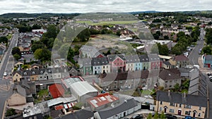 Aerial view of houses in town. Slide and pan shot of bright colour buildings in Carmody Street Business Park. Ennis