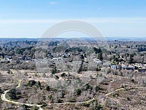Aerial view of housing on the edge of heathland in southern UK