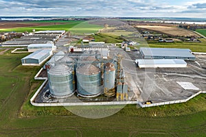 aerial view of huge agro-industrial complex with silos and grain drying line