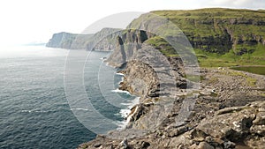 Aerial view of huge cliffs in Faroe Islands.