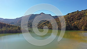 Aerial view of a huge decanting lake, full with mining residuals from a copper and gold mine with cyanidation or cyanide leaching