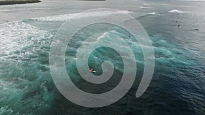 Aerial view of huge ocean waves and surfing in Bali indonesia