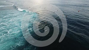 Aerial view of huge ocean waves and surfing in Bali indonesia