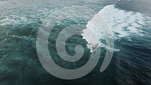 Aerial view of huge ocean waves and surfing in Bali indonesia