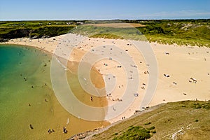 Aerial view of a huge sandy beach and clear waters Broad Haven South, Pembrokeshire, Wales