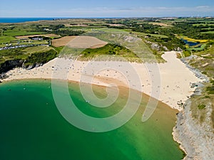 Aerial view of a huge sandy beach and clear waters Broad Haven South, Pembrokeshire, Wales