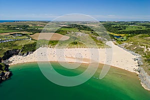 Aerial view of a huge sandy beach and clear waters Broad Haven South, Pembrokeshire, Wales