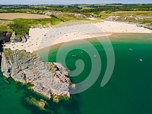 Aerial view of a huge sandy beach and clear waters Broad Haven South, Pembrokeshire, Wales