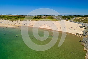 Aerial view of a huge sandy beach and clear waters Broad Haven South, Pembrokeshire, Wales