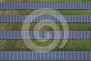 Aerial view of the huge solar power plant. Alternative clean green energy using renewable solar energy. Drone photo