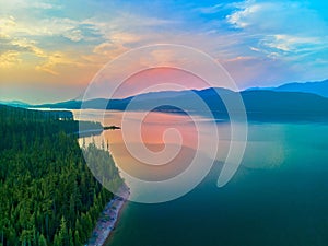 Aerial view of Hungry Horse Reservoir with forest fire in the distance located in the Flathead National Forest, MT
