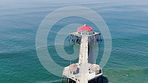 Aerial view of Huntington Pier, beach and coastline during sunny summer day