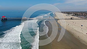 Aerial view of Huntington Pier, beach and coastline during sunny summer day