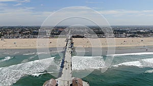 Aerial view of Huntington Pier, beach and coastline during sunny summer day