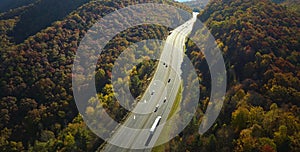 Aerial view of I-40 freeway in North Carolina leading to Asheville through Appalachian mountains in golden fall with