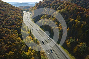 Aerial view of I-40 freeway in North Carolina leading to Asheville through Appalachian mountains in golden fall with