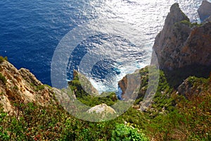 Aerial view at the iconic cliffs of Capri island in Campania, Naples, Italy