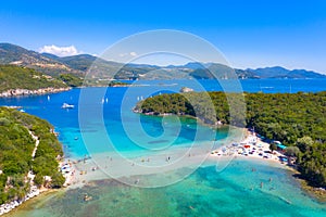 Aerial view of iconic paradise sandy beaches with turquoise sea in complex islands of Agios Nikolaos and Mourtos in Sivota.