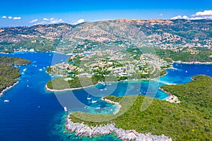 Aerial view of iconic paradise sandy beaches with turquoise sea in complex islands of Agios Nikolaos and Mourtos in Sivota.