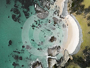 Aerial view of idyllic arc beach with pristine waters