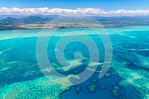 Aerial view of idyllic azure turquoise blue lagoon of West Coast barrier reef, New Caledonia, Oceania, Coral sea.
