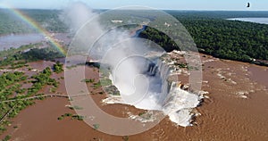 Aerial view of Iguazu Falls with birds flying and a rainbow in the background, Misiones, Argentine