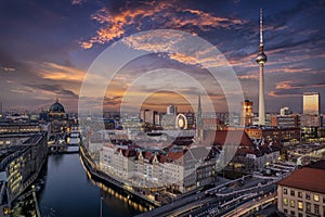 Aerial view of the illuminated Berlin skyline and Spree river during beautiful sunset photo