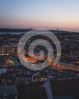 Aerial view of the illuminated Lisbon cityscape in Portugal during sunset