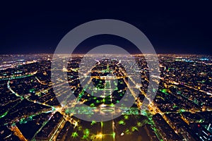 aerial view of illuminated night city panorama of Paris with street lights, drone top view from above, Champs Elysees