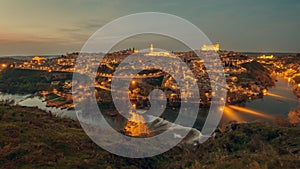 Aerial view illuminated with night street lights Toledo city. Spain